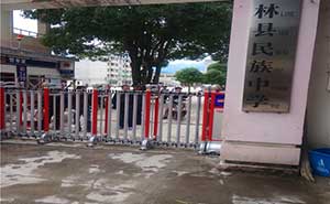 上林縣民族中學伸縮門案例 - 中出網(wǎng)-智能出入口與停車充電門戶